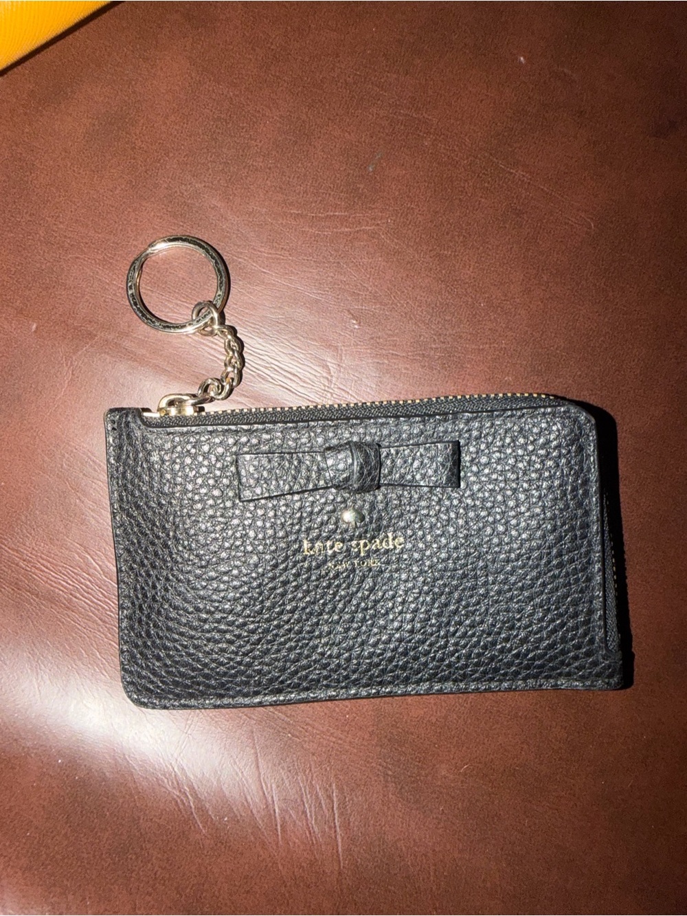kate spade black pebbled leather key pouch with bow and gold hardware